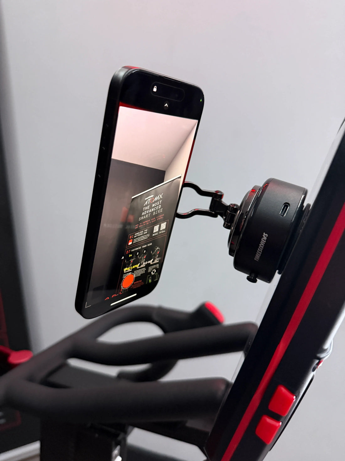 The Smart Vacuum Mount holding a phone sideways from its adjustable arm